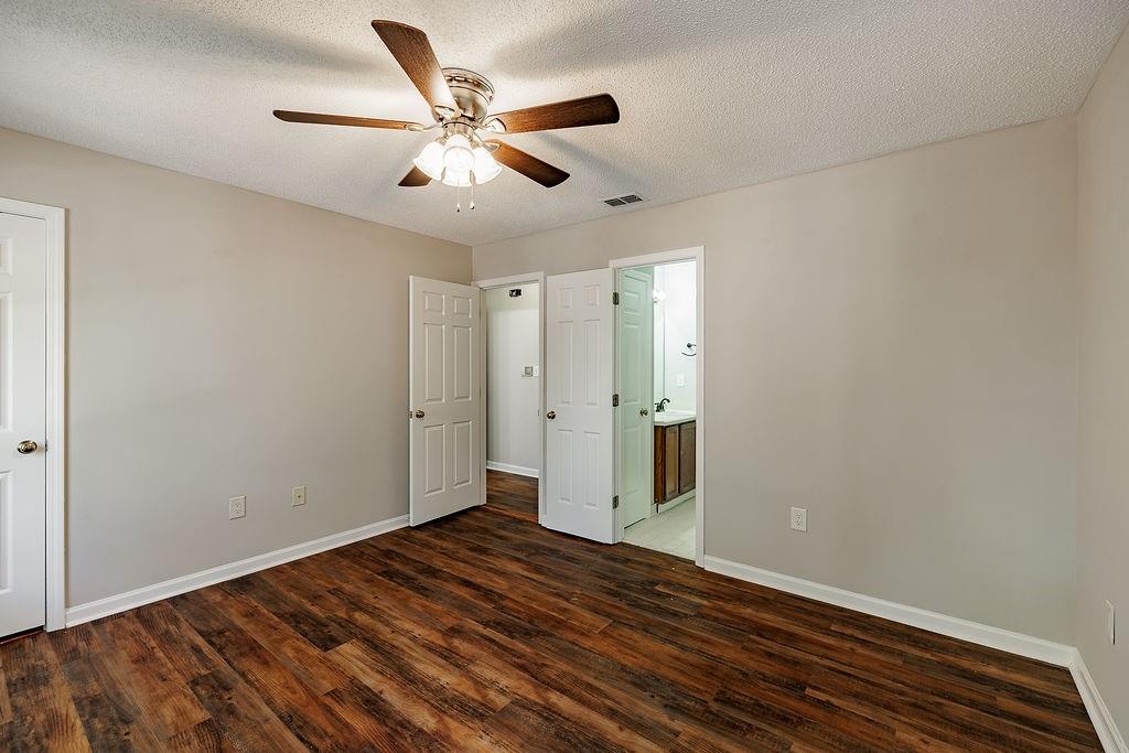 345 Research Drive, Unit 330 Athens, GA 30605 - Photo 10 of 31 a view of a livingroom with wooden floor and a ceiling fan