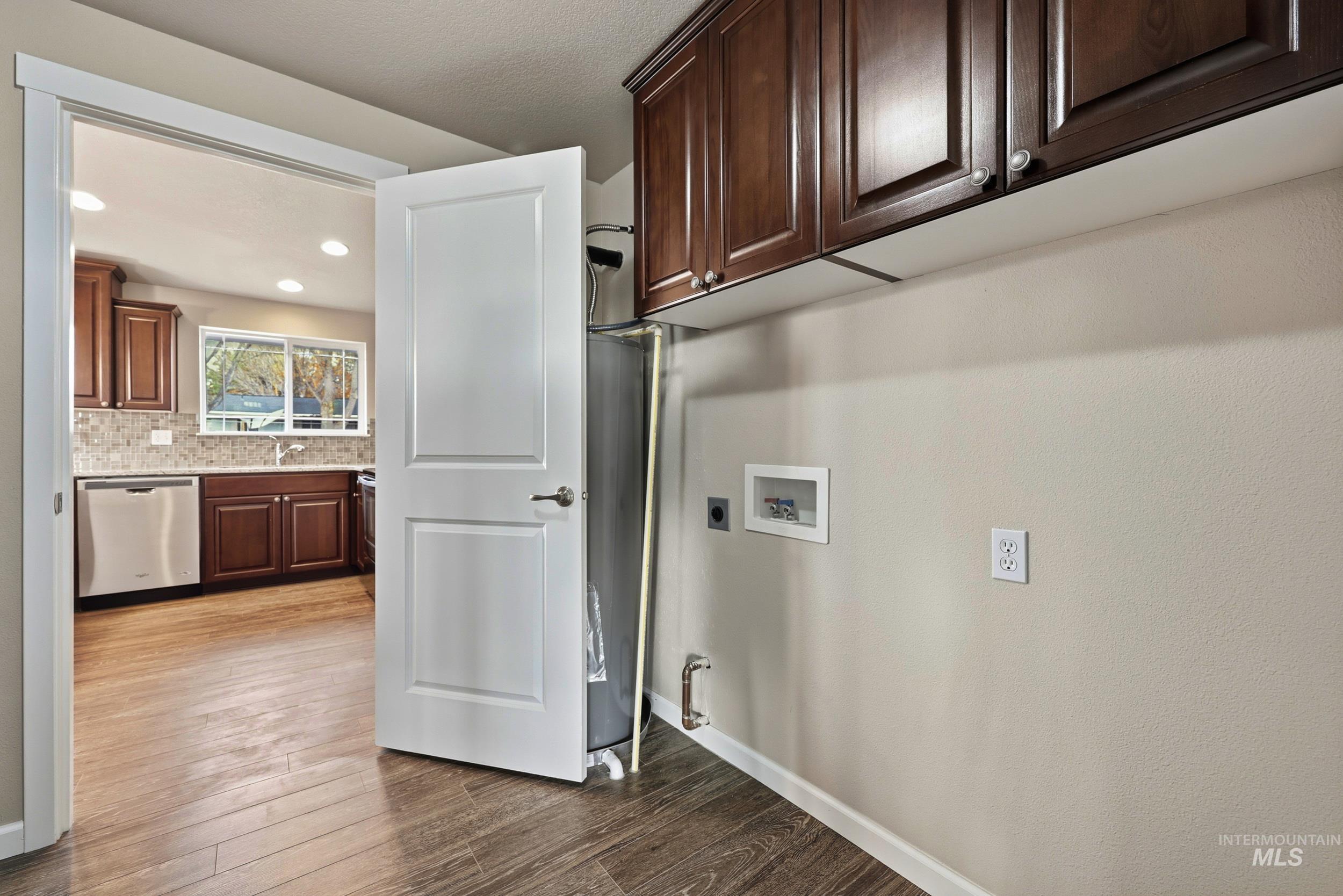 20203 Top Road Greenleaf, ID 83626 - Photo 10 of 16 Washroom with dark wood-type flooring, hookup for a washing machine, and recessed lighting