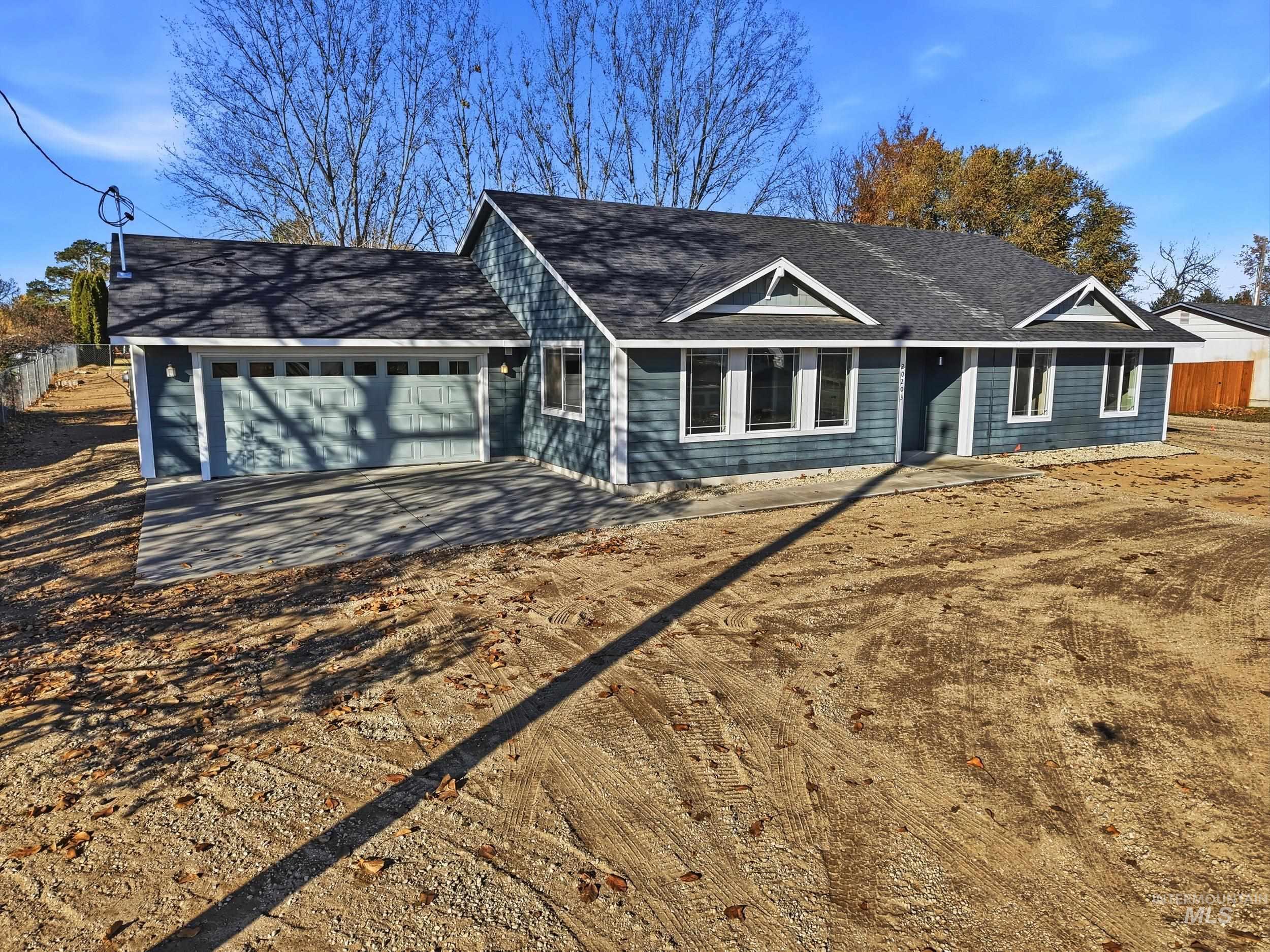 20203 Top Road Greenleaf, ID 83626 - Photo 3 of 16 Single story home with roof with shingles