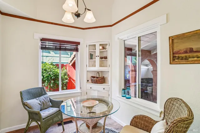 a dining room with furniture and window