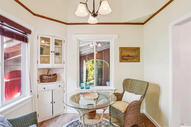a dining room with furniture and window