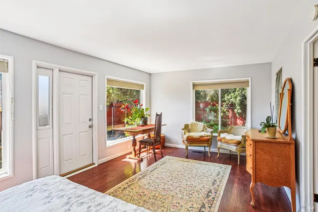 a living room with furniture rug and window