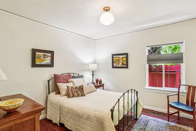 a bedroom with a bed and a desk