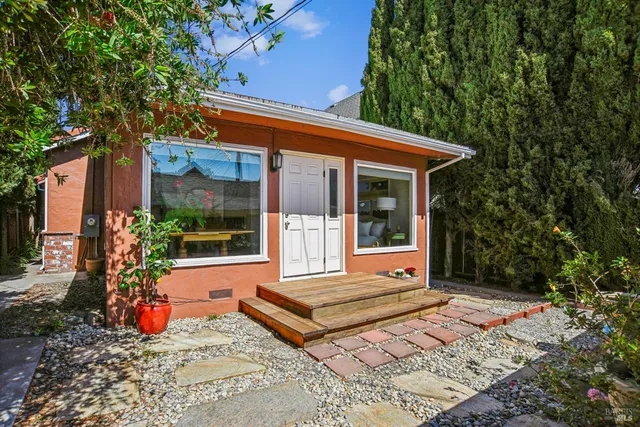 a backyard of a house with seating space