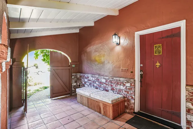 a view of a entryway door with wooden floor