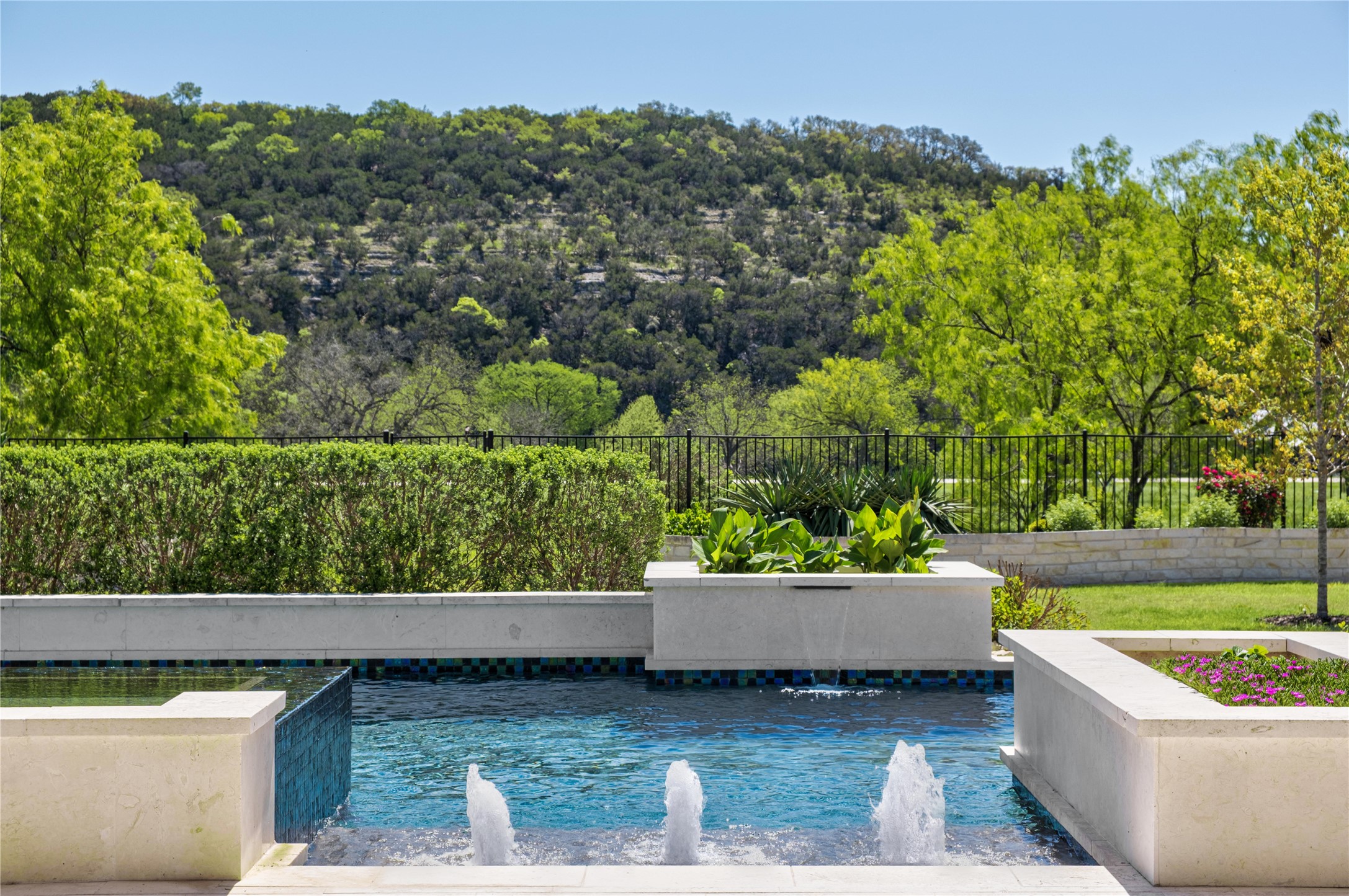 811 Wade Road Canyon Lake, TX 78132 - Photo 34 of 40 View of pool with fence, a view of trees, and a water view