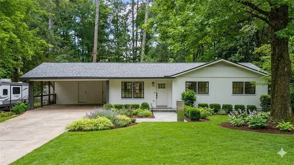 a front view of a house with a yard and porch