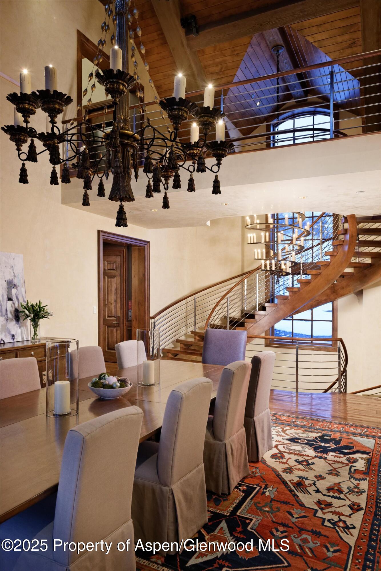 220 Buttermilk Lane Aspen, CO 81611 - Photo 11 of 60 a living room with lots of furniture and a wooden floor