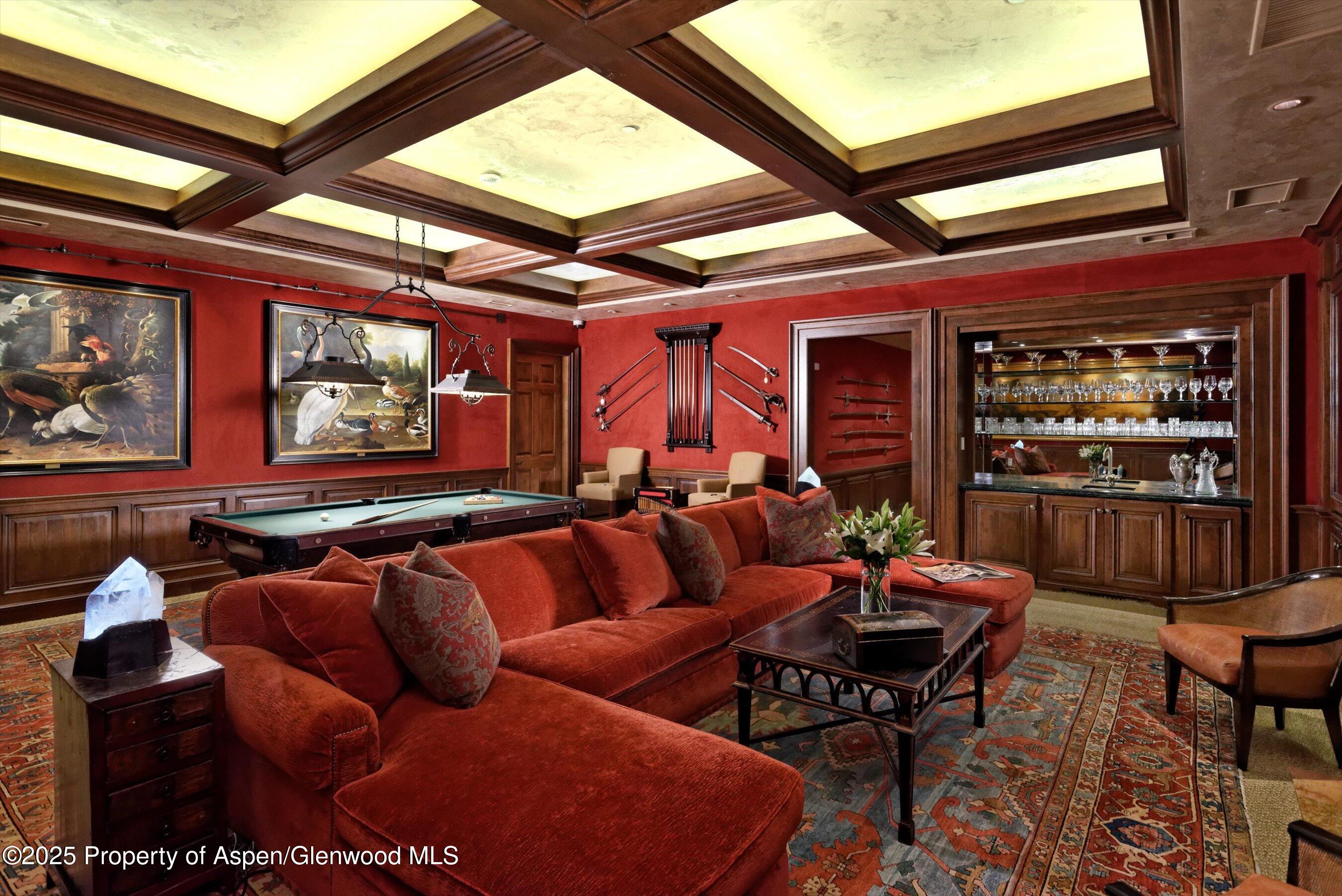 220 Buttermilk Lane Aspen, CO 81611 - Photo 18 of 60 a living room with furniture a rug and a large window