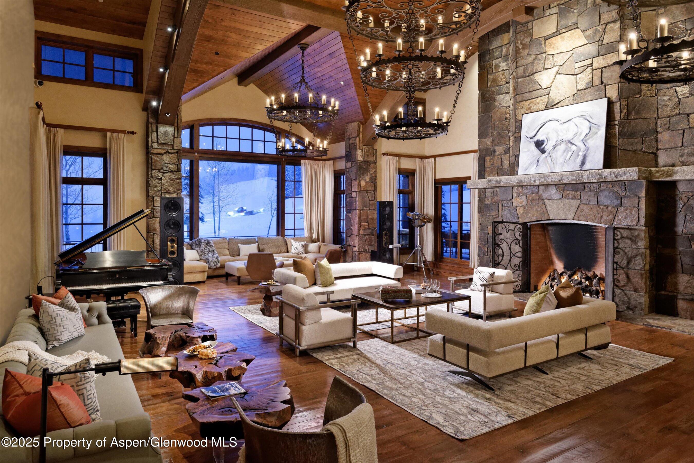 220 Buttermilk Lane Aspen, CO 81611 - Photo 24 of 60 a living room with furniture and a fireplace