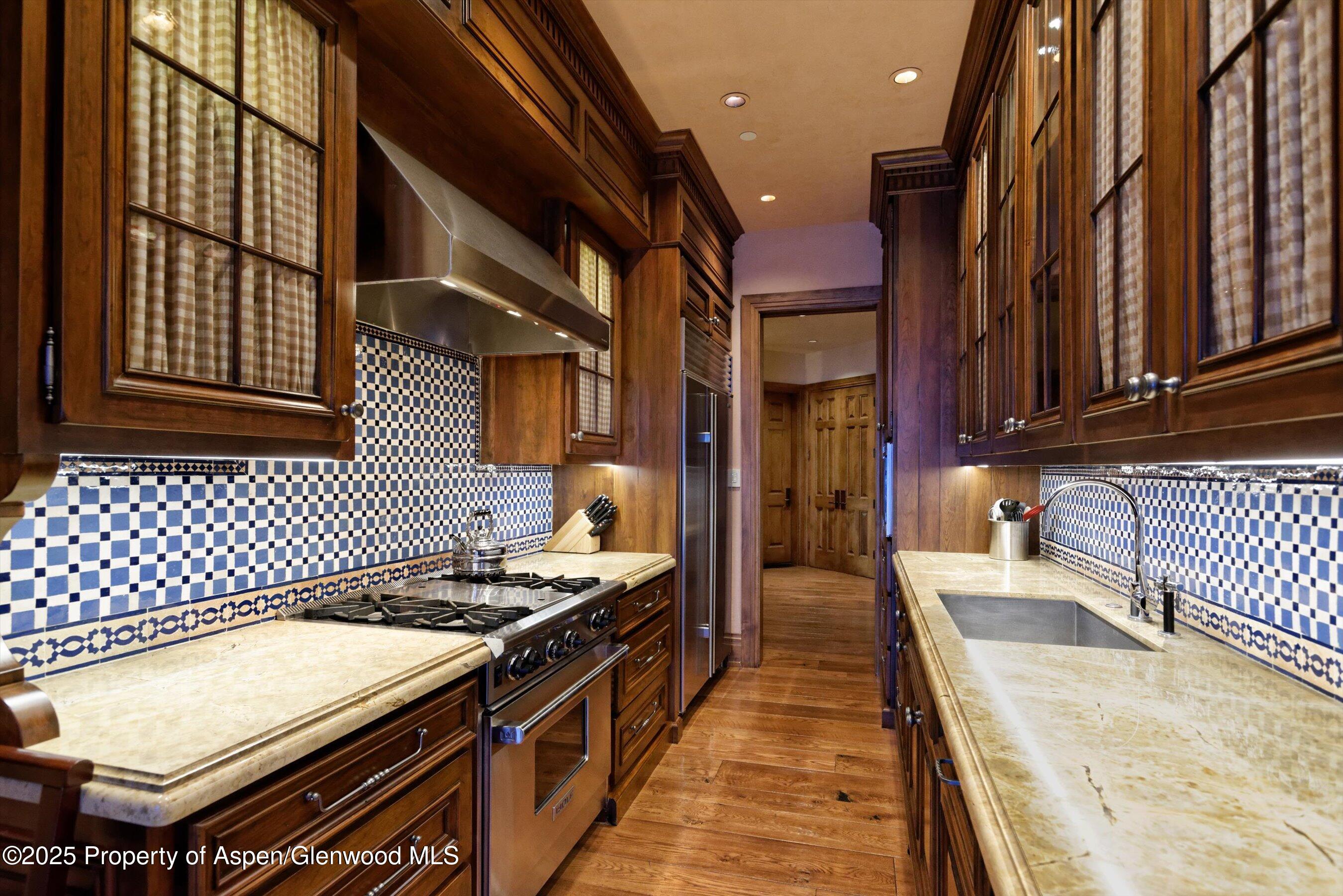 220 Buttermilk Lane Aspen, CO 81611 - Photo 25 of 60 a kitchen with a stove and a refrigerator