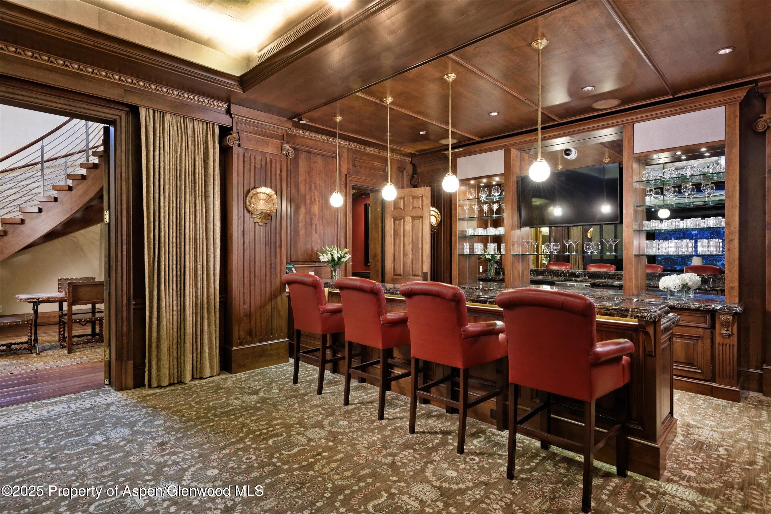 220 Buttermilk Lane Aspen, CO 81611 - Photo 26 of 60 a view of a dining room with furniture