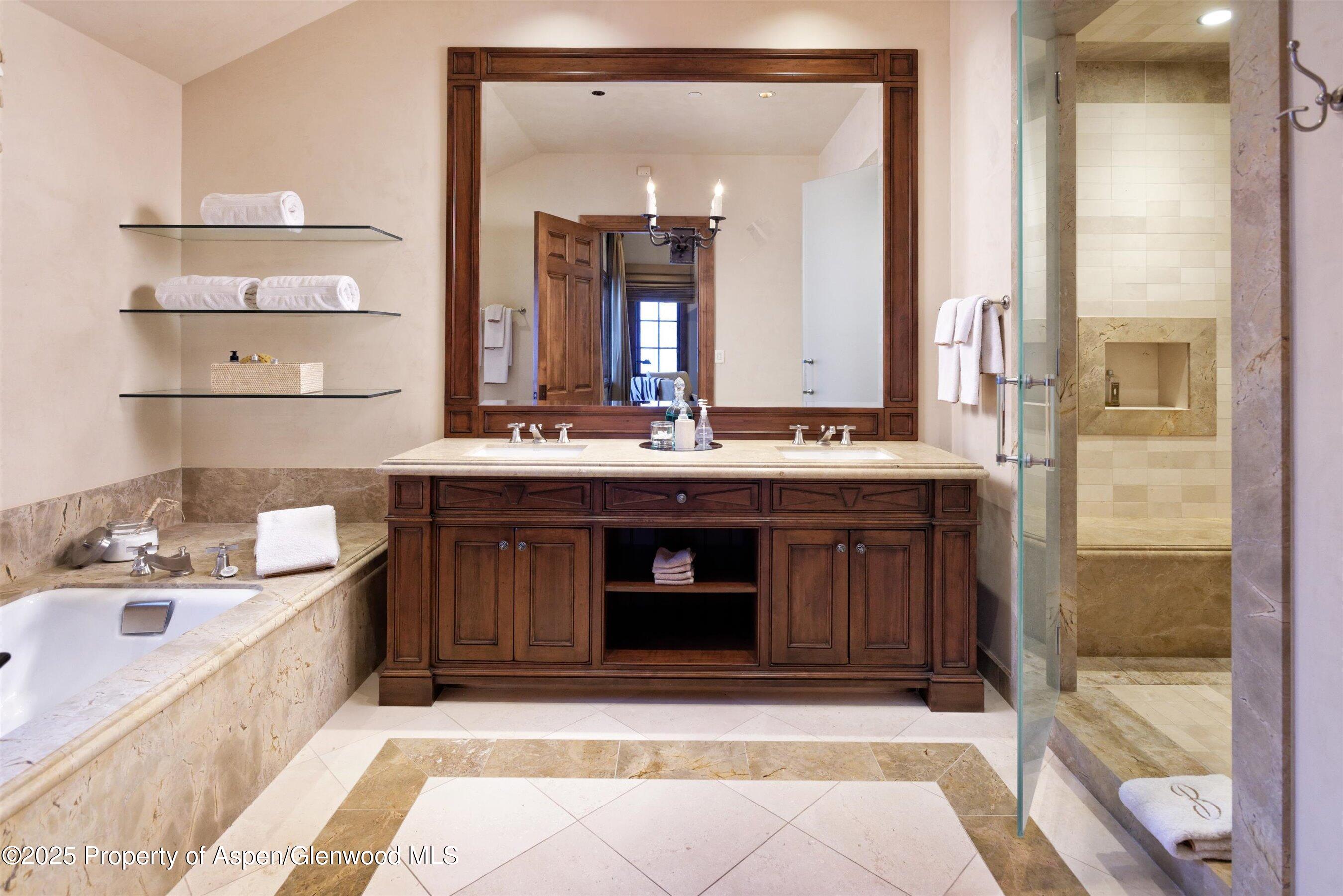 220 Buttermilk Lane Aspen, CO 81611 - Photo 31 of 60 a bathroom with a sink a vanity and a mirror