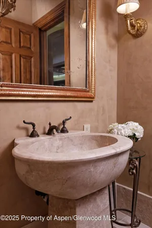 a view of a patio with a dining table and chairs under an umbrella