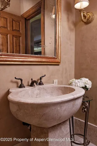 a view of a patio with a dining table and chairs under an umbrella