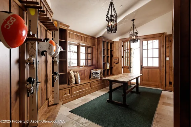 a patio with water fountain and a fire pit