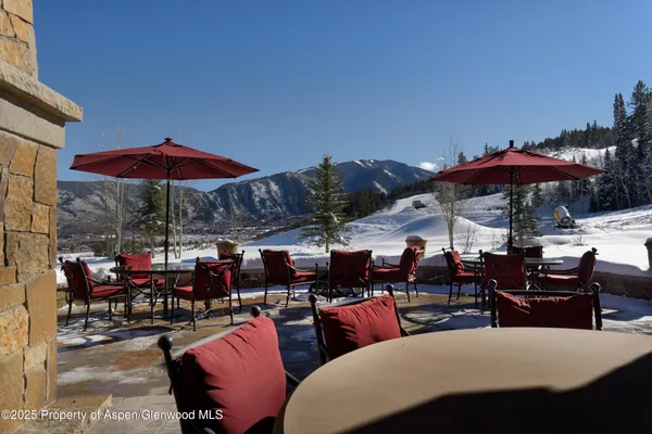 a view of backyard with swimming pool and outdoor seating