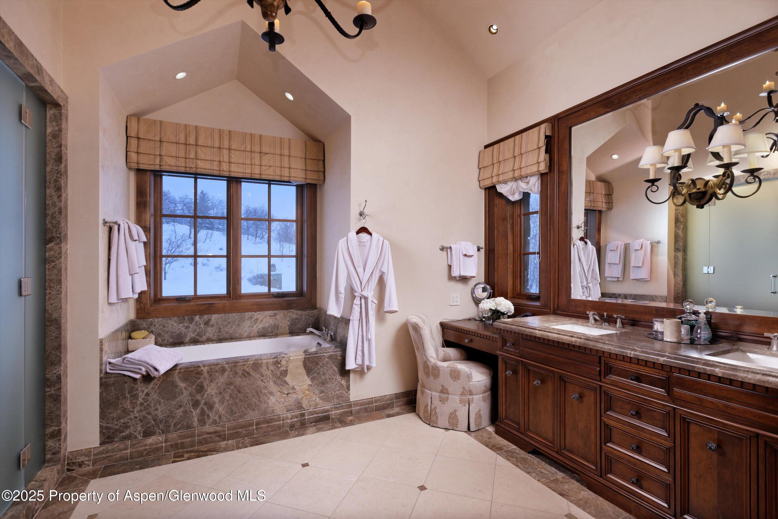 220 Buttermilk Lane Aspen, CO 81611 - Photo 7 of 60 a bathroom with a granite countertop tub and a sink