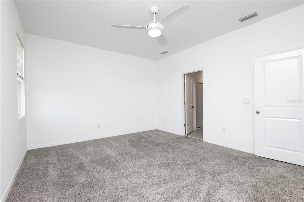 11851 Brighton Knoll Loop Riverview, FL 33579 - Photo 13 of 28 an empty room with fan and entrance