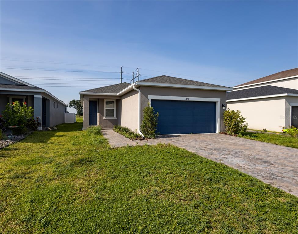 11851 Brighton Knoll Loop Riverview, FL 33579 - Photo 2 of 28 a front view of a house with a garden