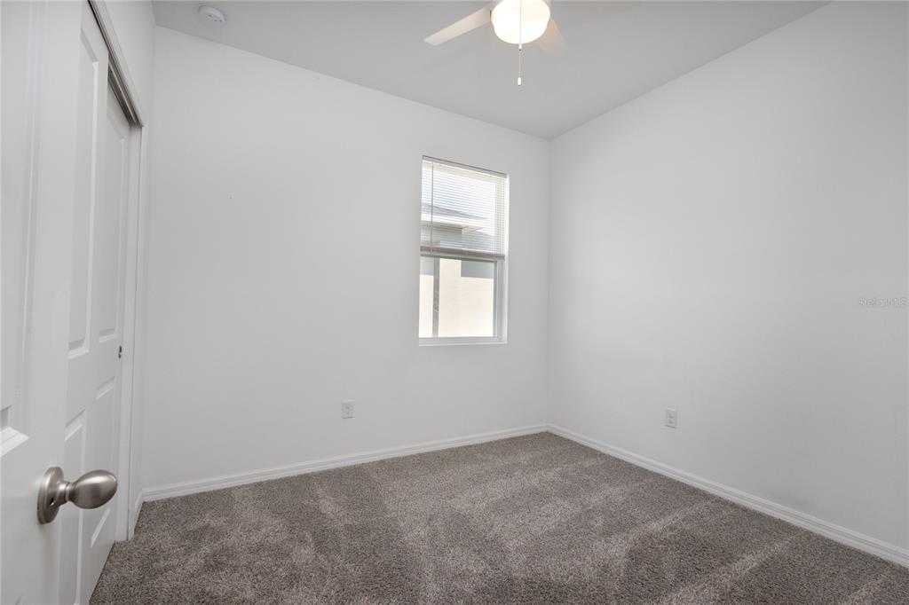 11851 Brighton Knoll Loop Riverview, FL 33579 - Photo 22 of 28 an empty room with a window
