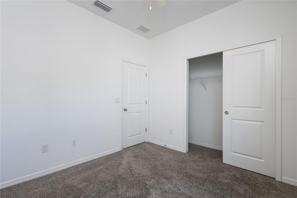 11851 Brighton Knoll Loop Riverview, FL 33579 - Photo 23 of 28 an empty room with closet area