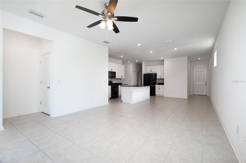 11851 Brighton Knoll Loop Riverview, FL 33579 - Photo 24 of 28 a view of a kitchen with a sink and a refrigerator