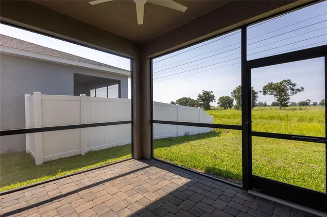 a view of a porch with a floor to ceiling window