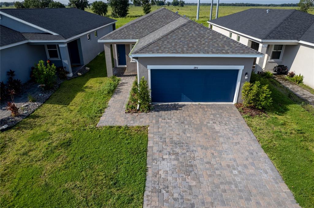 11851 Brighton Knoll Loop Riverview, FL 33579 - Photo 27 of 28 a front view of a house with garden