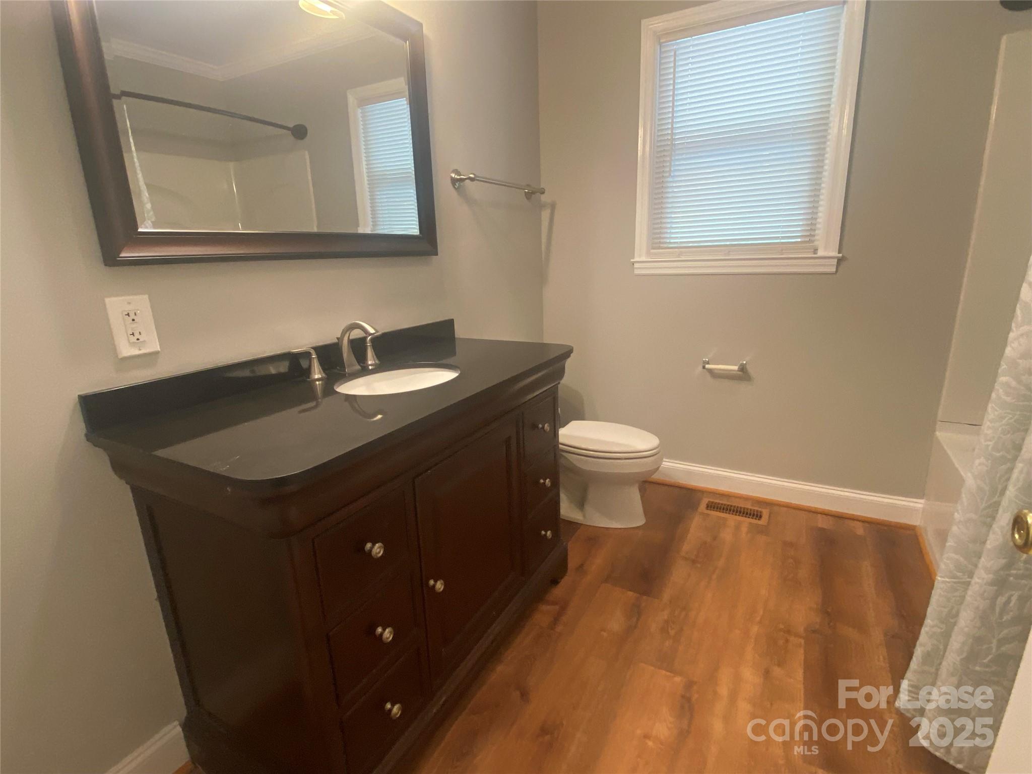 4530 Shiloh Unity Road Lancaster, SC 29720 - Photo 14 of 14 a bathroom with a sink toilet and mirror