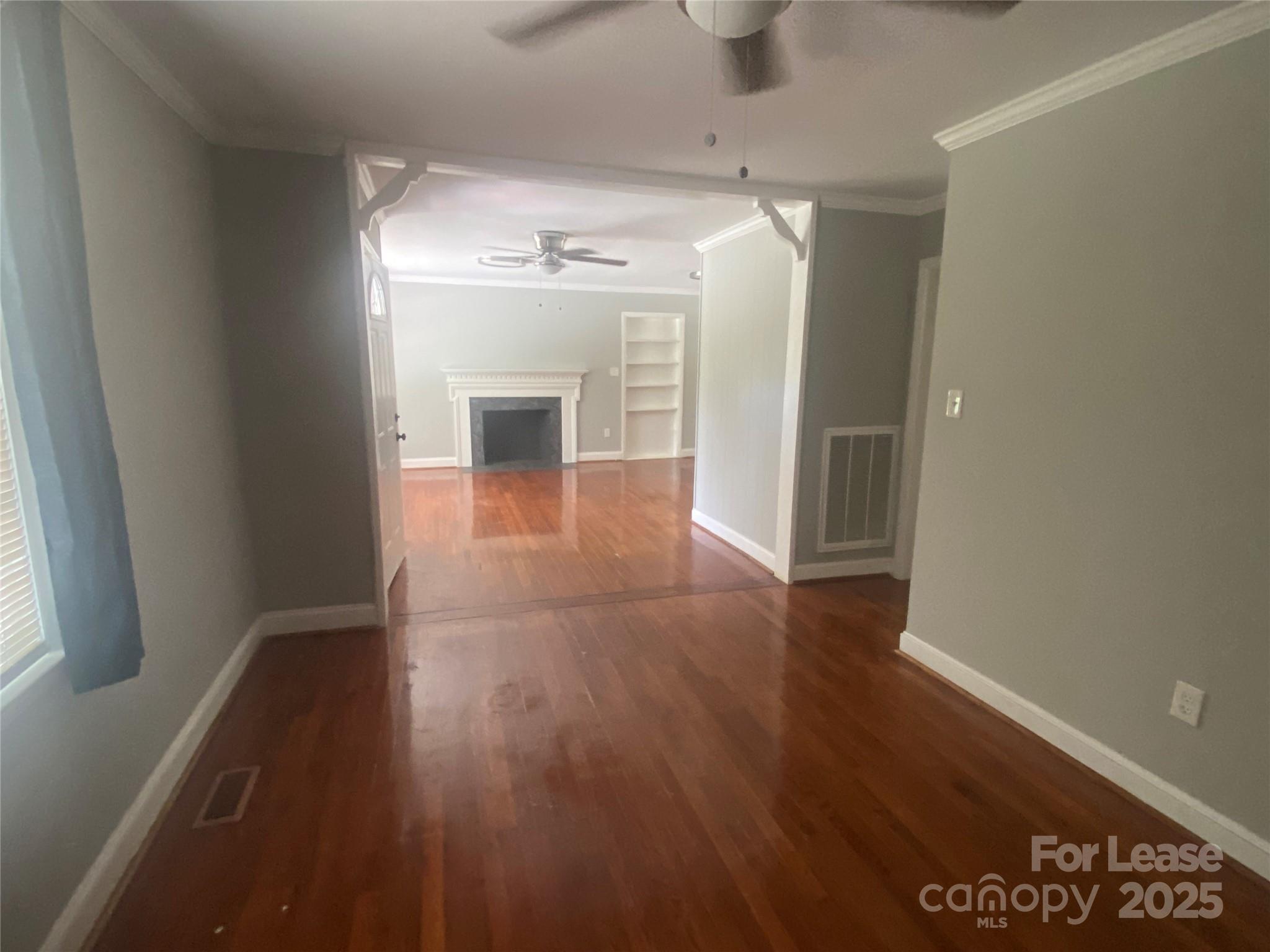 4530 Shiloh Unity Road Lancaster, SC 29720 - Photo 4 of 14 a view of a hallway with wooden floor and a living room