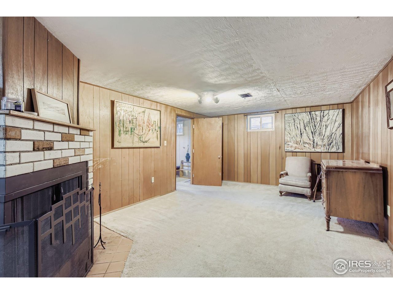 2431 West 24th Street Road Greeley, CO 80634 - Photo 24 of 32 BasementRecRoom W/Fireplace