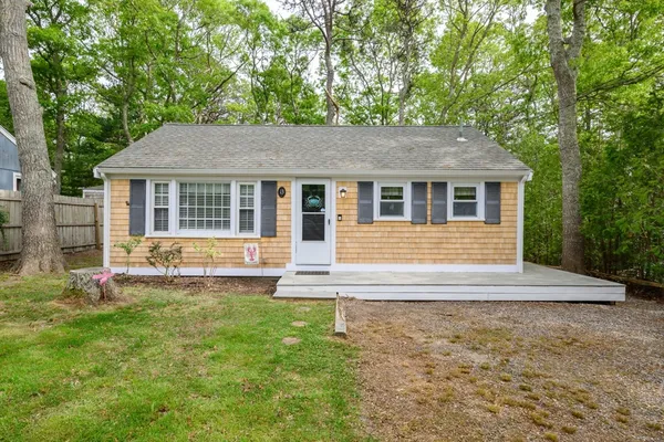 front view of a house with a yard