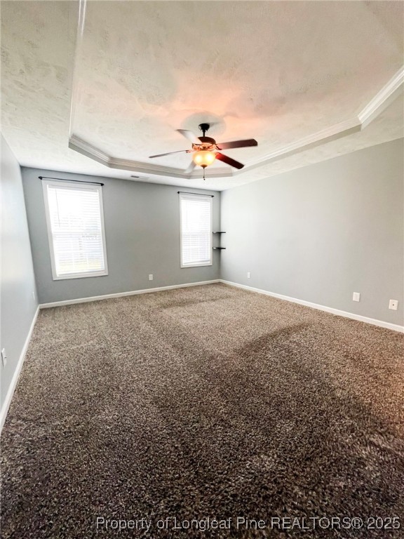 1516 Rough Rider Lane Parkton, NC 28371 - Photo 12 of 23 en empty room with windows and ceiling fan
