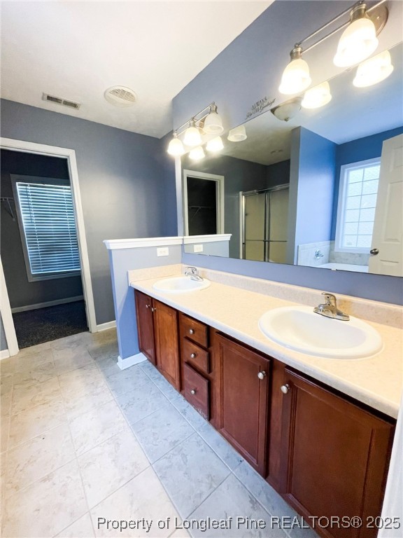 1516 Rough Rider Lane Parkton, NC 28371 - Photo 13 of 23 a bathroom with a sink double vanity and a mirror