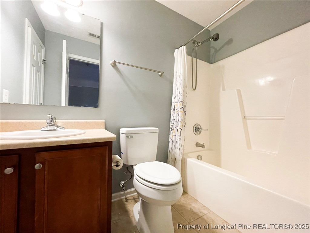 1516 Rough Rider Lane Parkton, NC 28371 - Photo 18 of 23 a bathroom with a sink toilet and shower