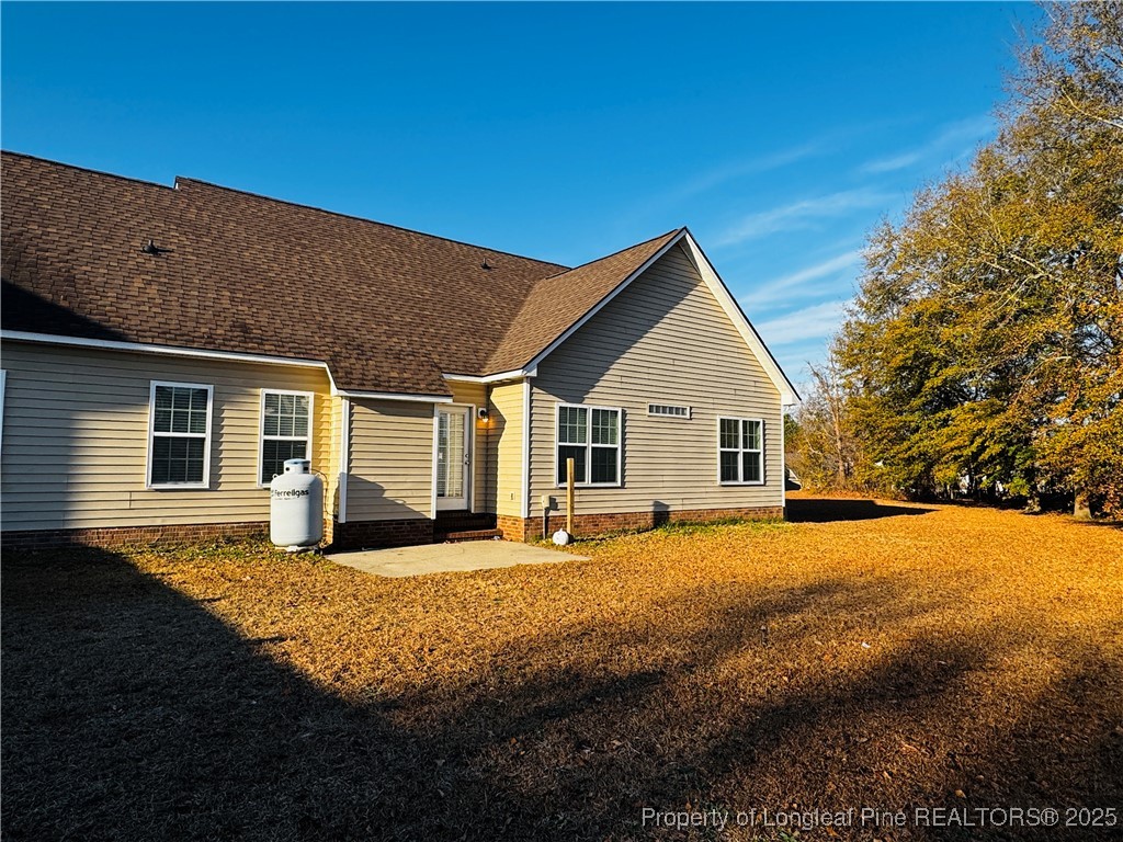 1516 Rough Rider Lane Parkton, NC 28371 - Photo 22 of 23 a front view of a house with a yard
