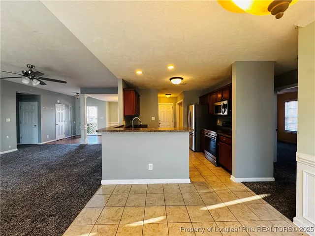 a view of livingroom with kitchen