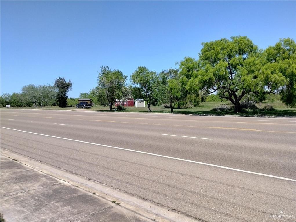 605 East Colorado Street Rio Hondo, TX 78583 - Photo 4 of 5 a backyard of a house with lots of green space and wooden fence
