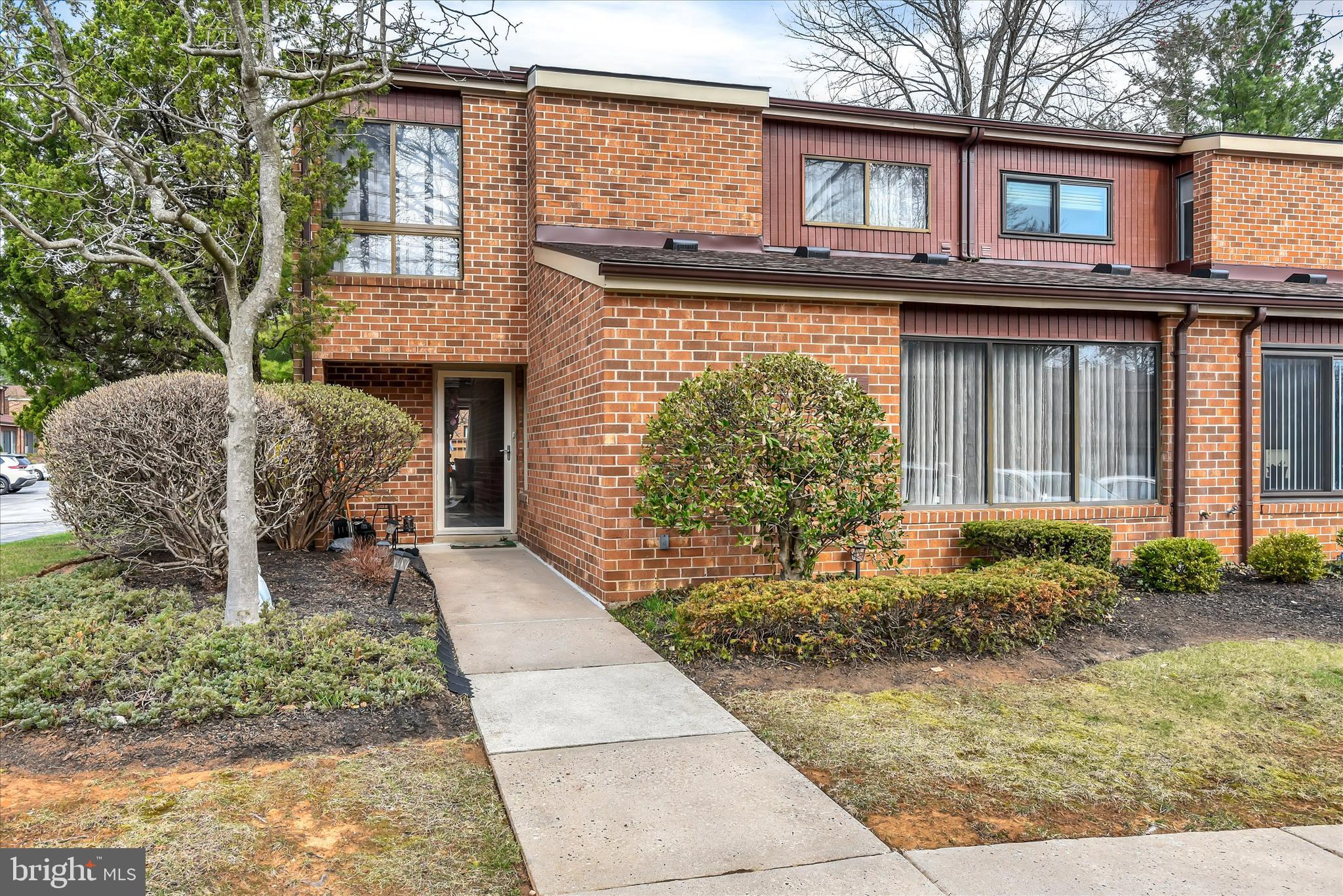 41 Stirrup Court, Unit 7 Baltimore, MD 21208 - Photo 1 of 34 a front view of a house with garden