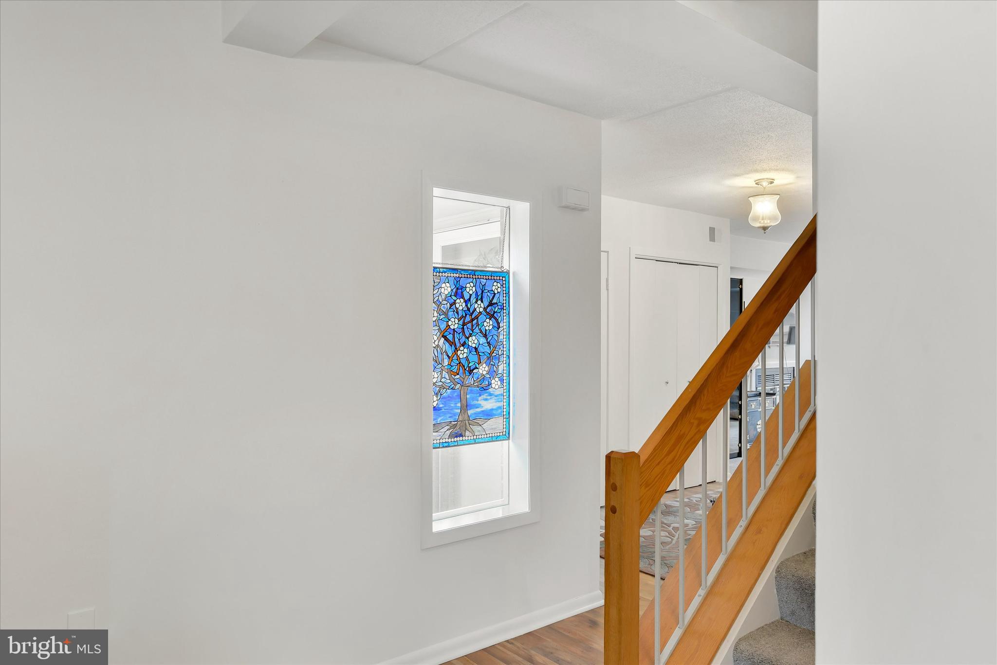 41 Stirrup Court, Unit 7 Baltimore, MD 21208 - Photo 13 of 34 a view of staircase with railing and white walls