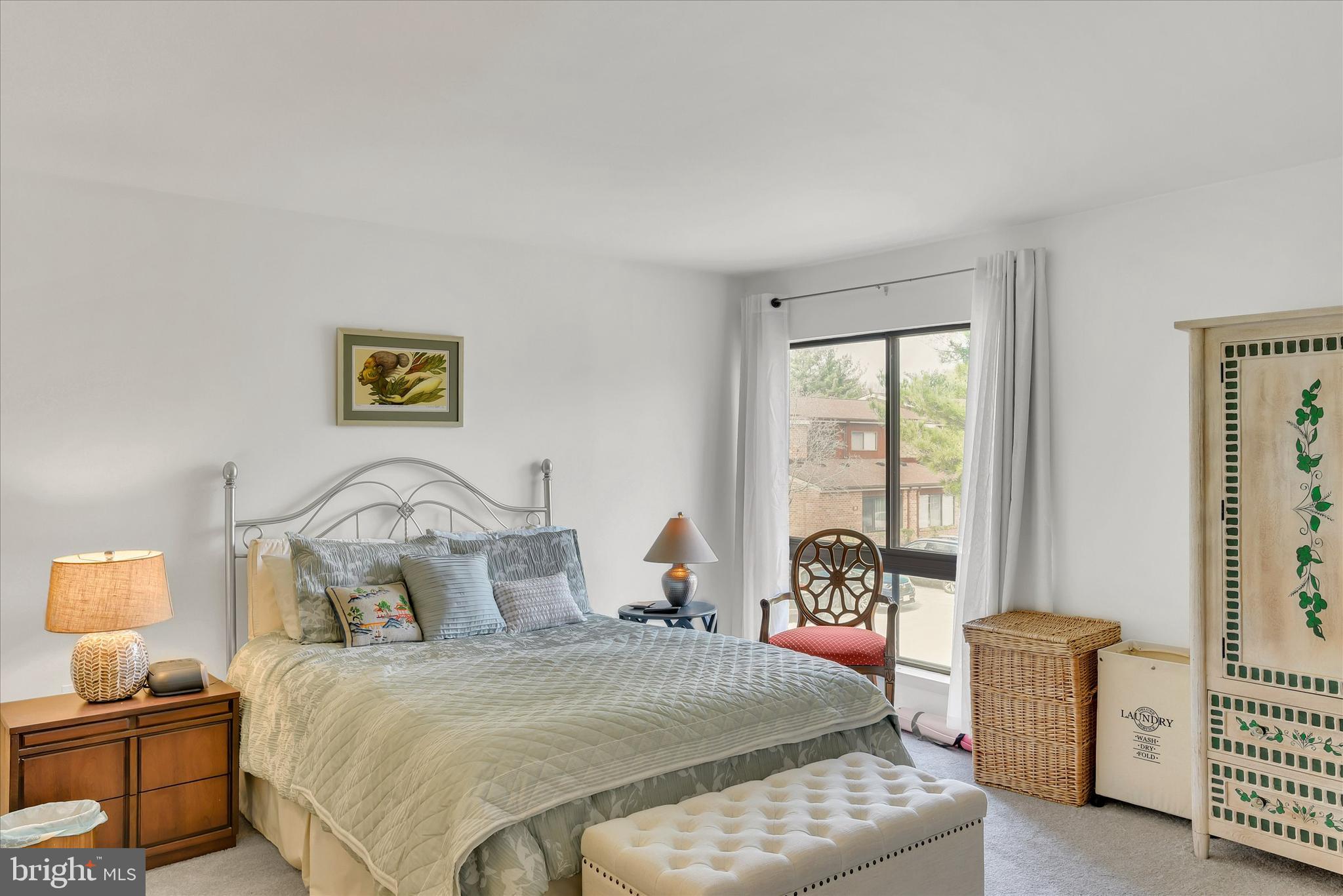 41 Stirrup Court, Unit 7 Baltimore, MD 21208 - Photo 18 of 34 a bedroom with a bed and wooden floor
