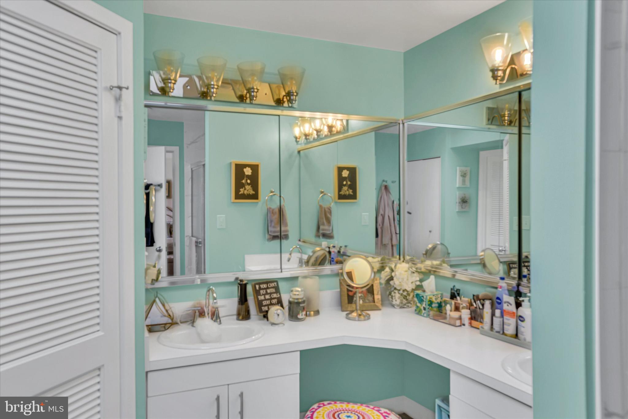41 Stirrup Court, Unit 7 Baltimore, MD 21208 - Photo 23 of 34 a bathroom with a sink mirror and vanity