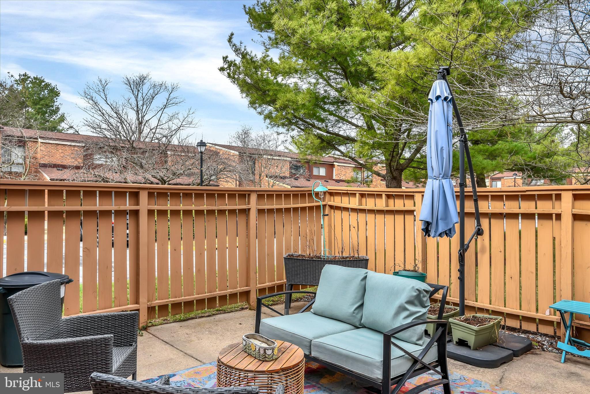 41 Stirrup Court, Unit 7 Baltimore, MD 21208 - Photo 25 of 34 a view of a patio with couches chairs and wooden floor
