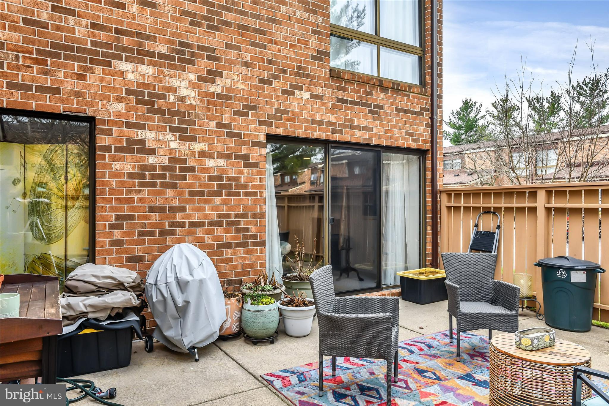 41 Stirrup Court, Unit 7 Baltimore, MD 21208 - Photo 26 of 34 a view of a patio with table and chairs and potted plants