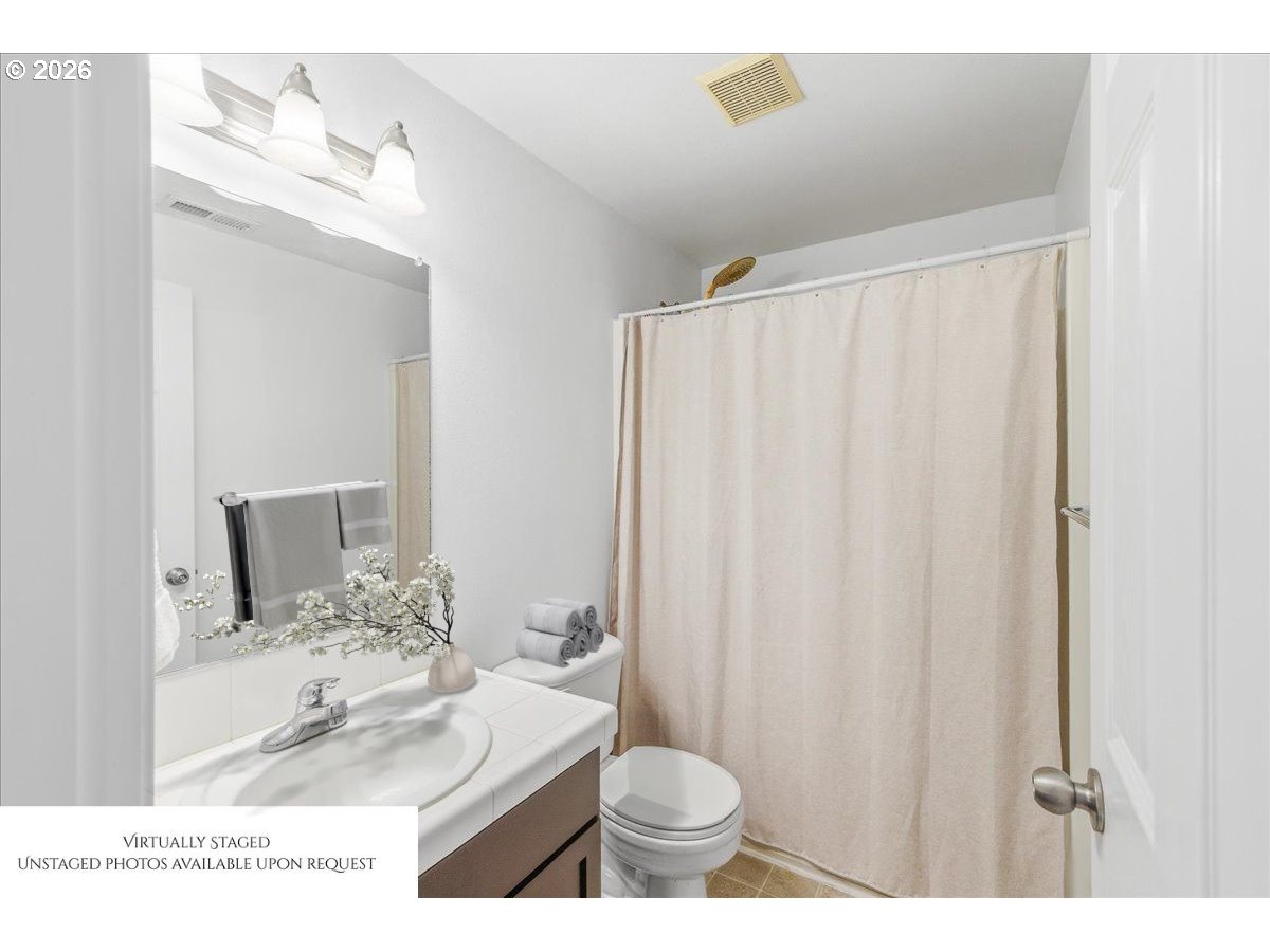 19240 Southwest Rosedale Court Beaverton, OR 97007 - Photo 23 of 38 a bathroom with a sink a toilet and shower