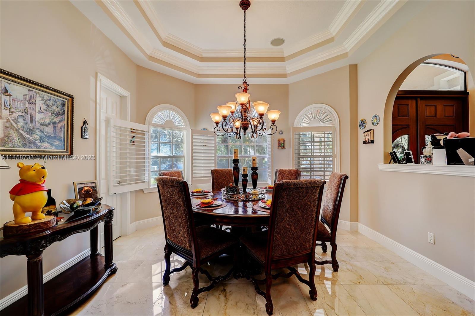 6051 Holatee Trail Southwest Ranches, FL 33330 - Photo 54 of 70 a dining room with furniture a chandelier and window