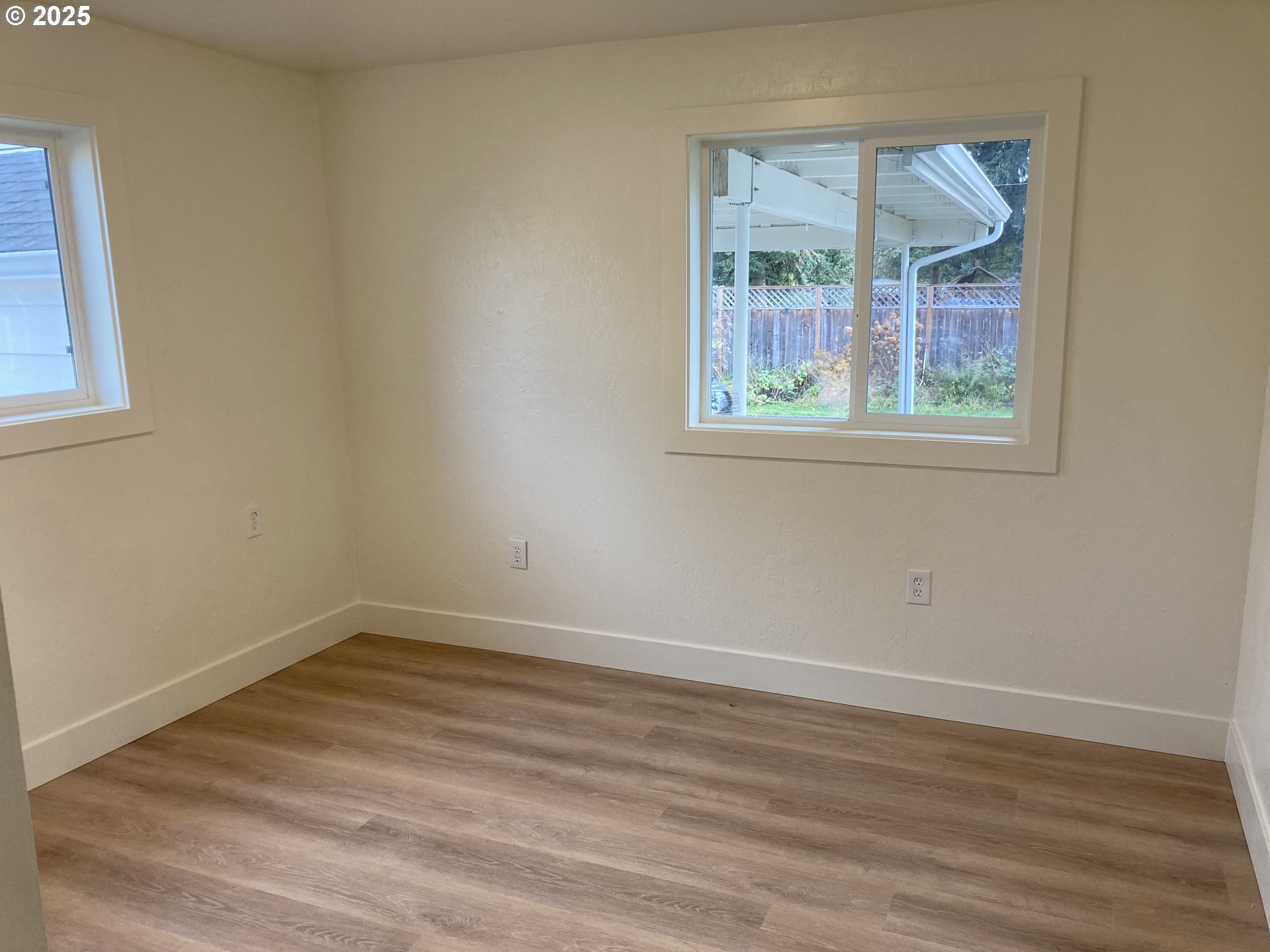 94034 Viking Street Junction City, OR 97448 - Photo 11 of 12 a view of an empty room with wooden floor and a window