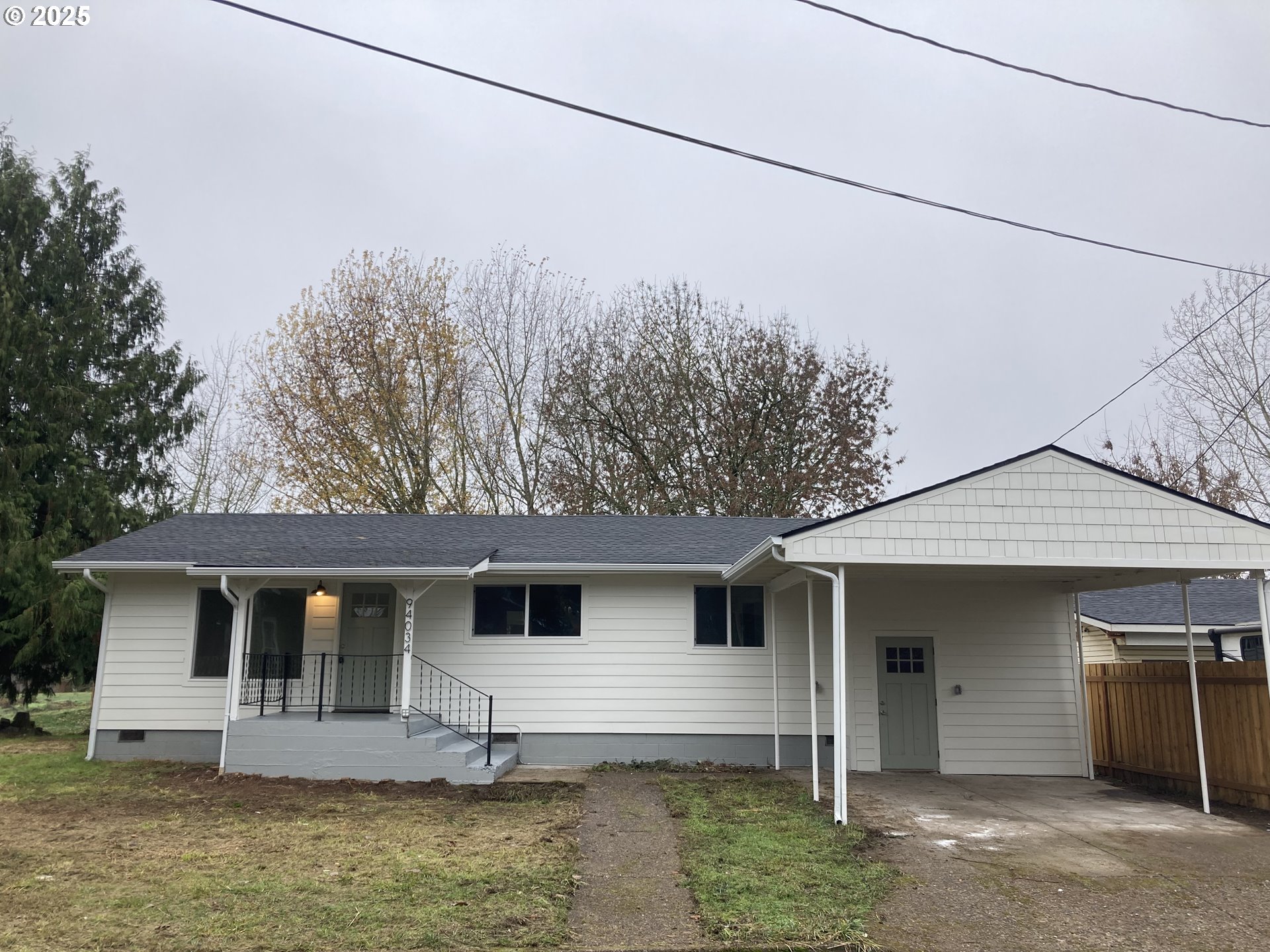 94034 Viking Street Junction City, OR 97448 - Photo 2 of 12 a front view of a house with a yard
