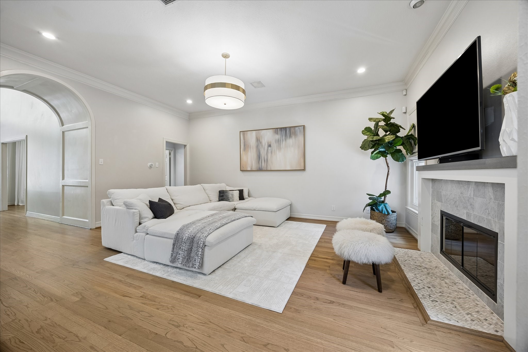 4131 Sunset Boulevard Houston, TX 77005 - Photo 18 of 38 a spacious bedroom with a bed and a flat screen tv